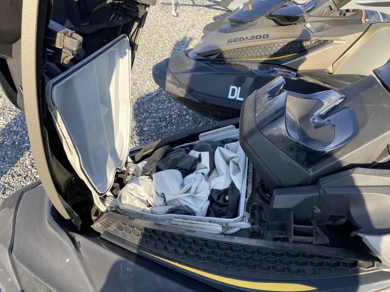 Slide: The Image of 2017 Sea-Doo GTX 155 with open storage compartment, revealing interior contents. - 8