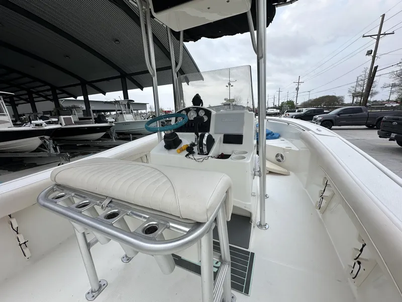 Slide: The Image of 2014 Mako 204 CC center console boat interior with helm and seating. - 10