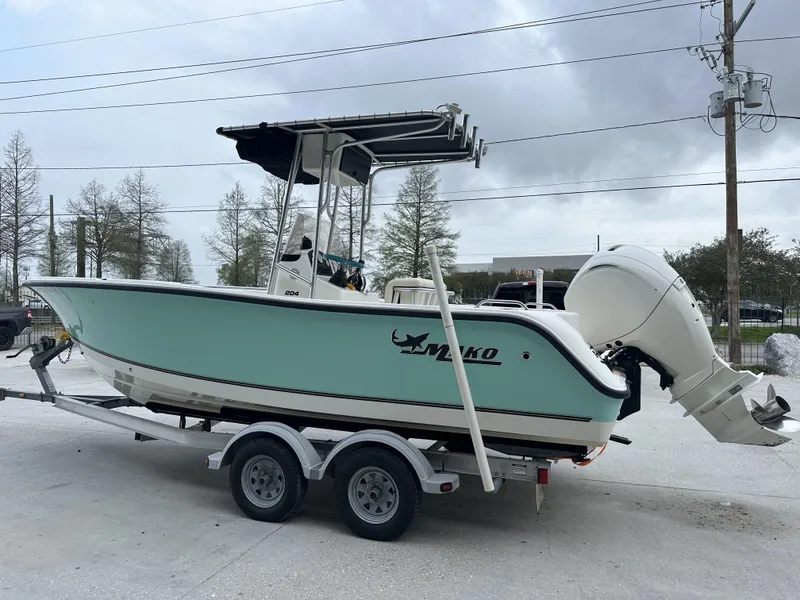 Slide: The Image of 2014 Mako 204 CC boat on trailer with outboard motor. - 6