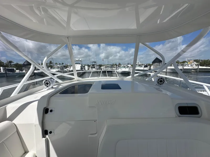 Slide: The Image of 2008 Intrepid 390 Sport Yacht at a marina, view from the helm. - 16