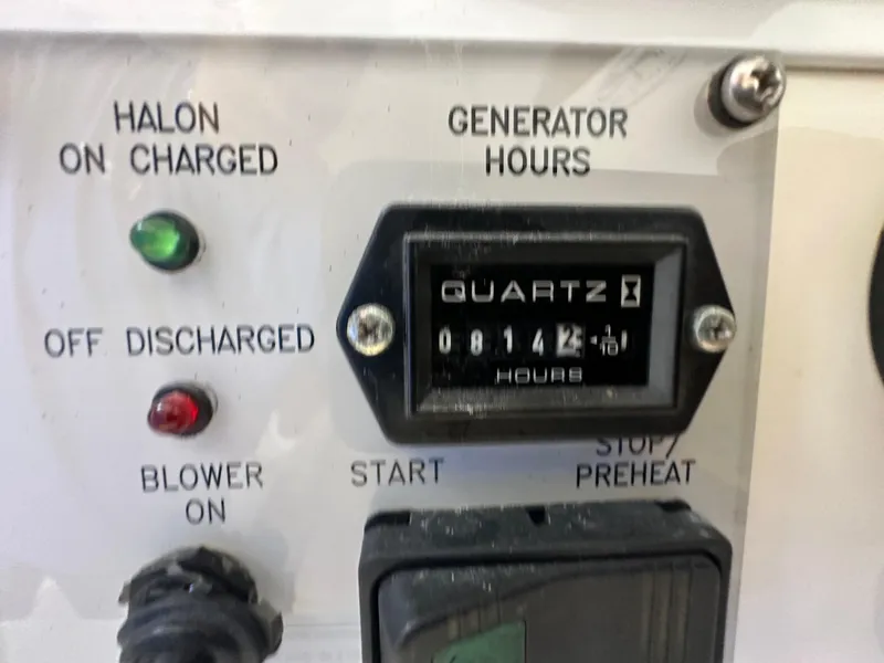 Slide: The Image of 2008 Intrepid 390 Sport Yacht generator hours meter and control panel - 19