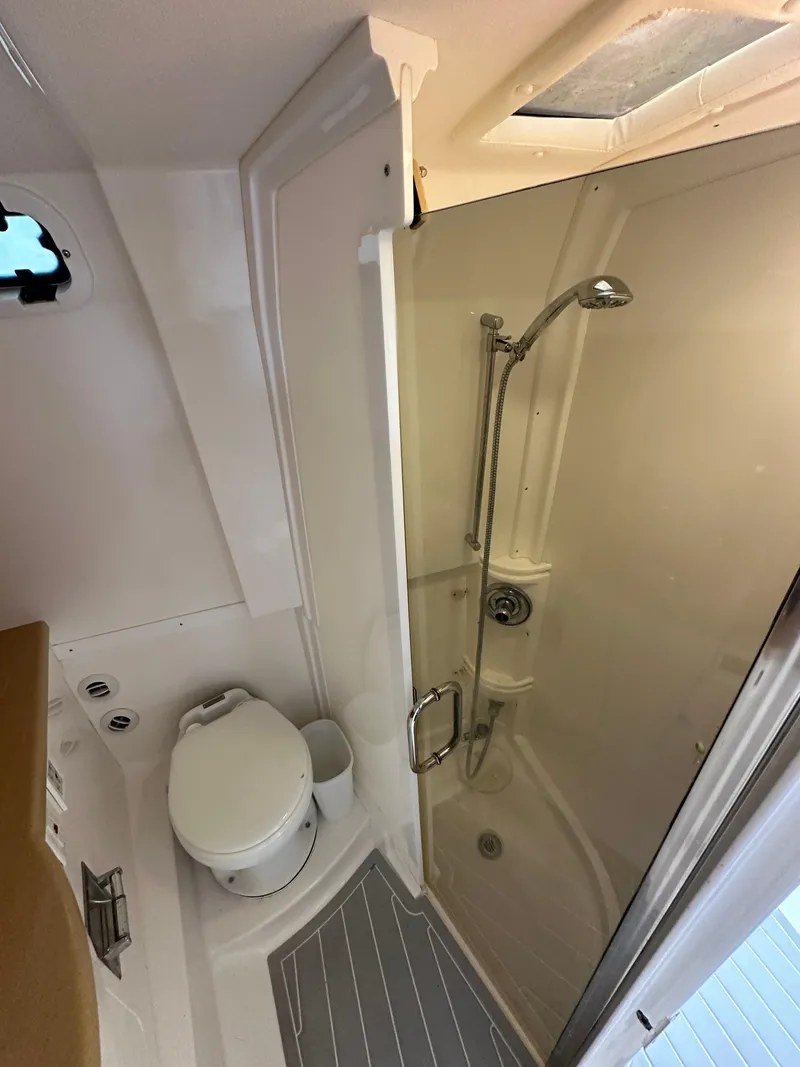 Slide: The Image of 2008 Intrepid 390 Sport Yacht bathroom with shower and toilet. - 24