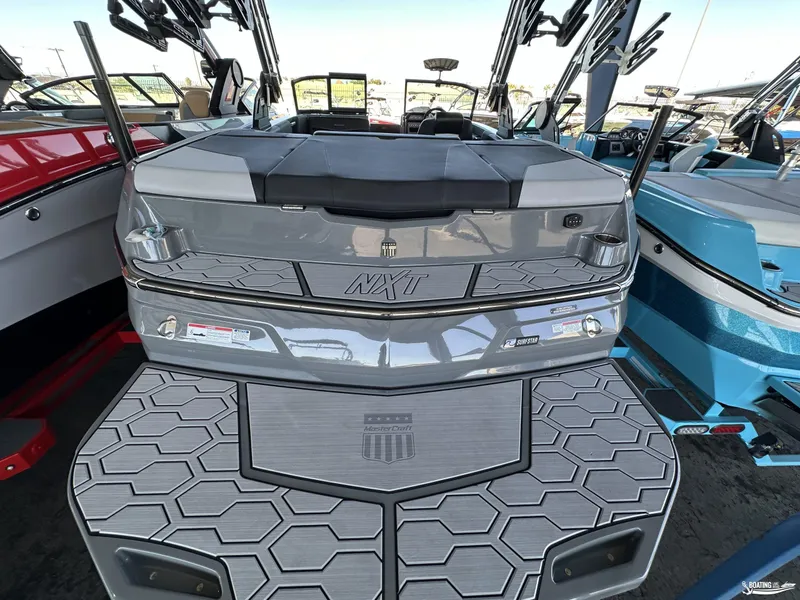 Slide: The Image of 2024 MasterCraft NXT21 boat with sleek design and modern features. - 4