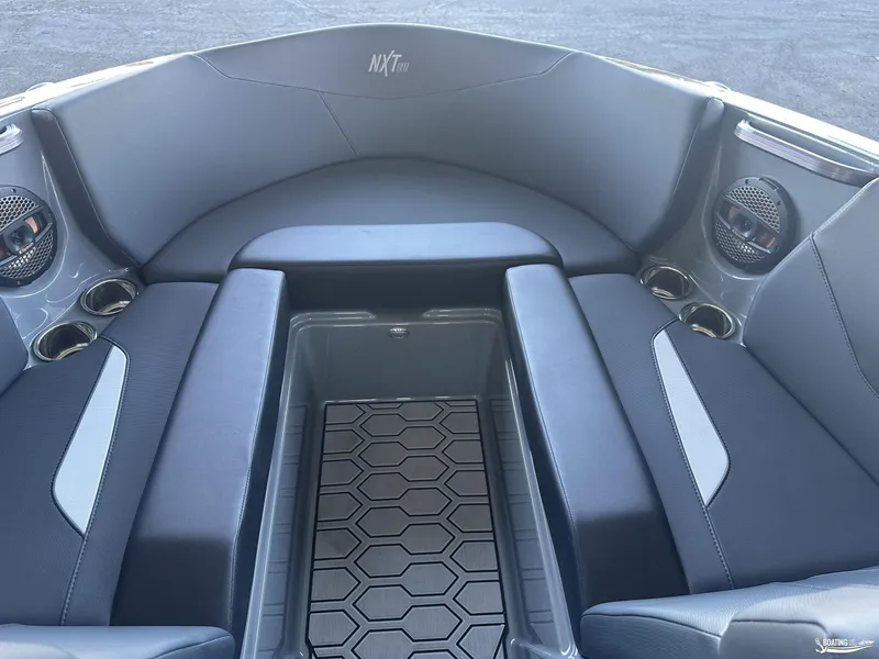 Slide: The Image of 2024 MasterCraft NXT21 boat interior with sleek seating and modern design. - 5