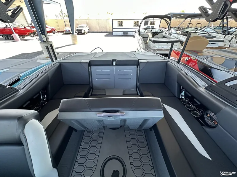 Slide: The Image of 2024 MasterCraft NXT21 boat interior with modern seating and sleek design. - 6