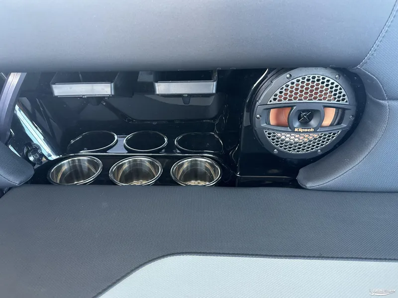 Slide: The Image of 2024 MasterCraft NXT21 interior with Klipsch speaker and cup holders. - 9