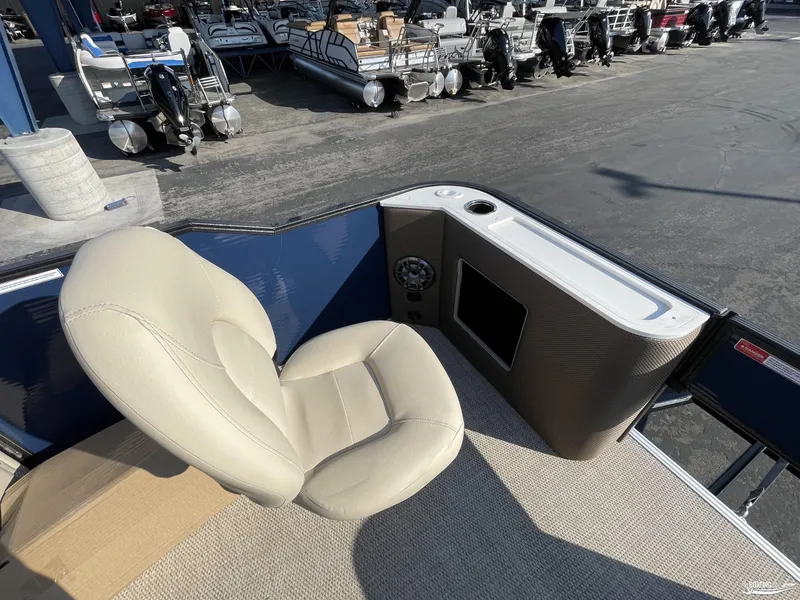 Slide: The Image of 2023 Crest 200 Classic Fish boat interior with beige seat and control panel. - 11