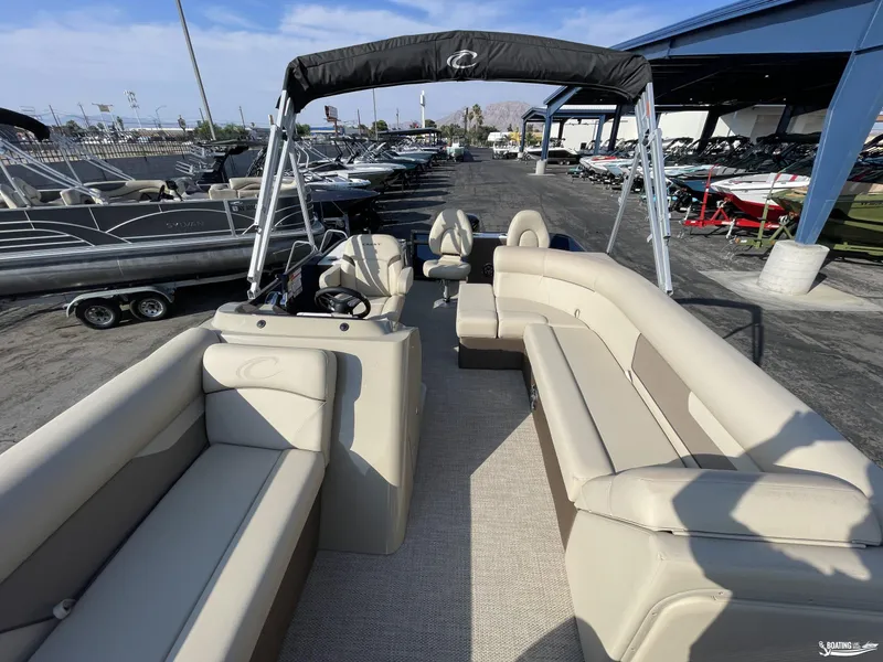 Slide: The Image of 2023 Crest 200 Classic Fish pontoon boat with spacious seating and modern design. - 12