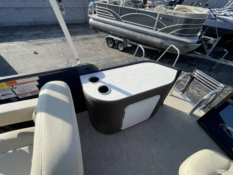 Slide: The Image of 2023 Crest 200 Classic Fish boat interior with seating and storage. - 8