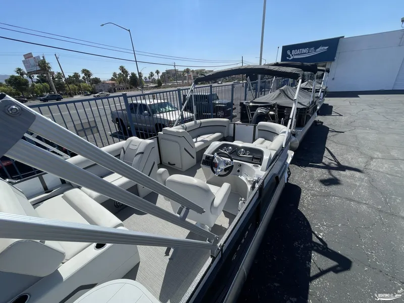 Slide: The Image of 2023 Crest 220 LX Classic SLS pontoon boat at a dealership. - 8