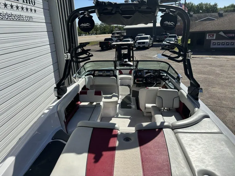 Slide: The Image of 2010 Nautique Super Air Nautique 226 interior with red and white seating. - 3