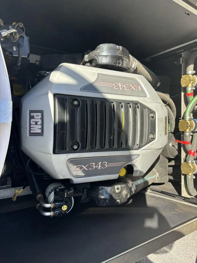 Slide: The Image of 2010 Nautique Super Air Nautique 226 PCM EX343 engine close-up. - 8