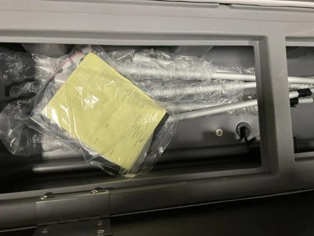 Slide: The Image of 2024 Bennington 22 SVSR-SPS pontoon boat interior with gray and beige seating. - 11