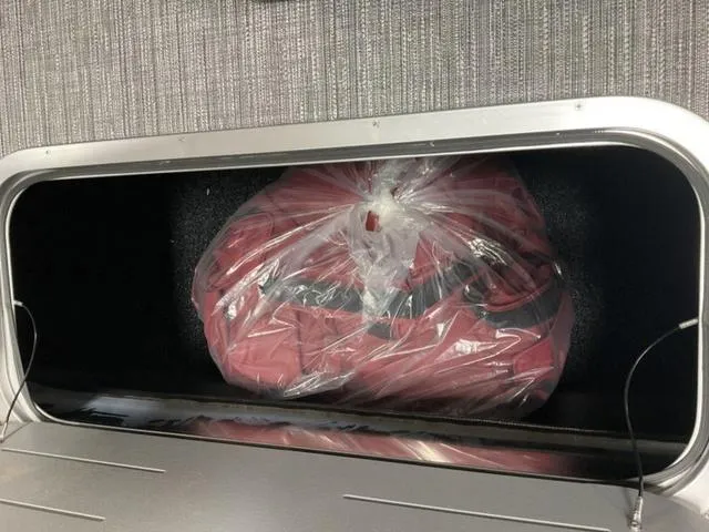 Slide: The Image of Storage compartment in 2024 Bennington 22 SVSR-SPS boat with bag inside. - 19