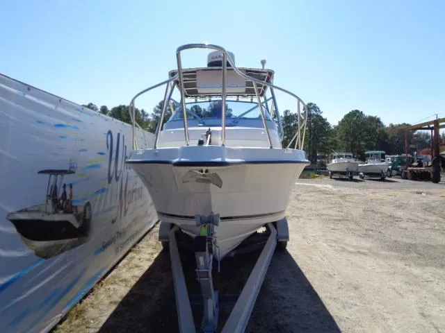 Slide: The Image of 2000 Robalo 2240 Walkaround boat on a trailer in a boatyard. - 17
