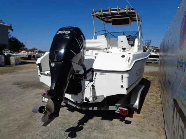 Slide: The Image of 2000 Robalo 2240 Walkaround boat with outboard motor on trailer. - 19