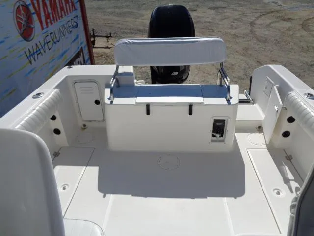 Slide: The Image of 2000 Robalo 2240 Walkaround boat deck with seating and storage compartments. - 21
