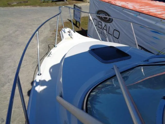 Slide: The Image of 2000 Robalo 2240 Walkaround boat deck with railing and hatch. - 33