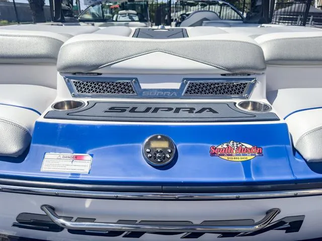 Slide: The Image of 2013 Supra SA 350 boat interior with South Austin Marine sticker. - 10