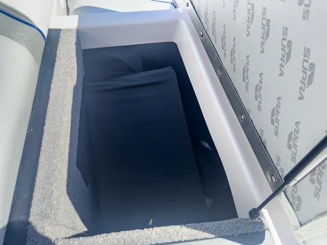 Slide: The Image of 2013 Supra SA 350 storage compartment with upholstery and branding. - 17