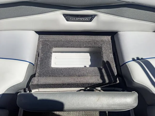 Slide: The Image of 2013 Supra SA 350 boat interior with storage compartment. - 18