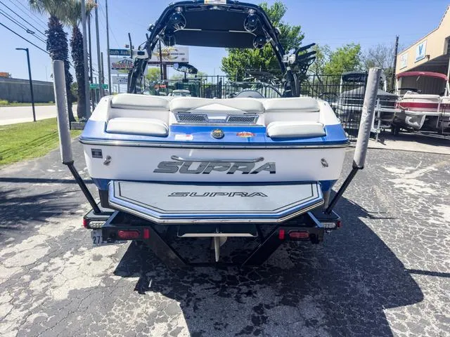 Slide: The Image of 2013 Supra SA 350 boat, rear view, parked on pavement. - 3