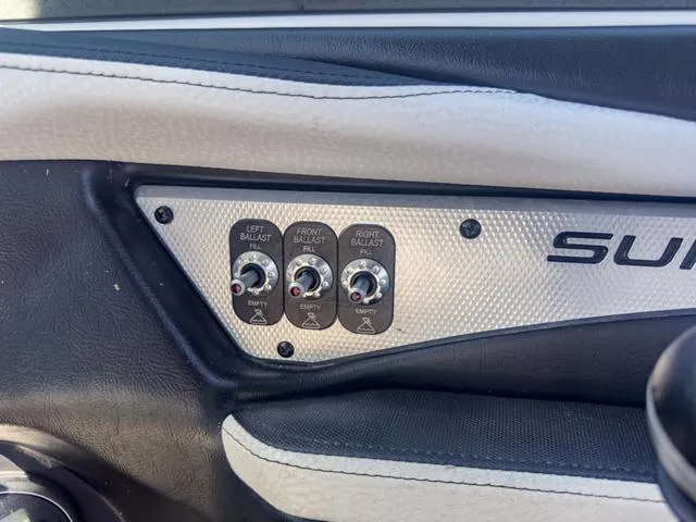 Slide: The Image of Control panel of a 2013 Supra SA 350 boat with ballast switches. - 31