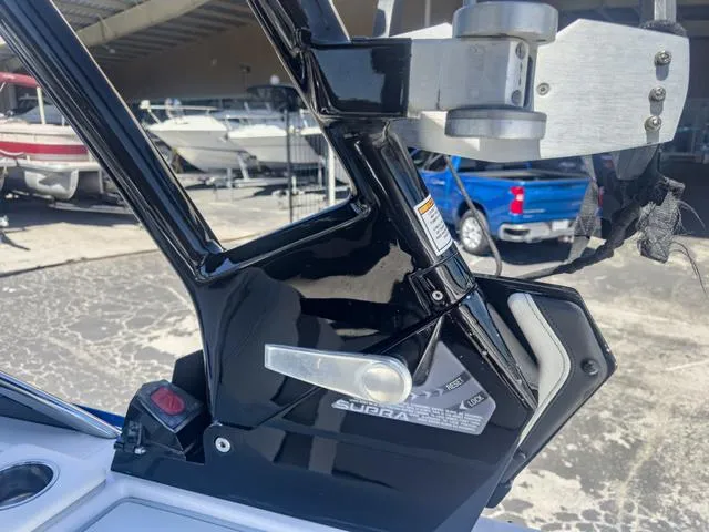 Slide: The Image of 2013 Supra SA 350 boat tower mechanism in a marina. - 37