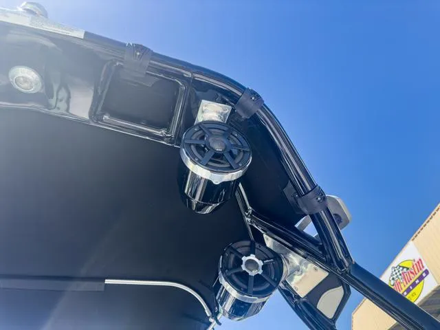 Slide: The Image of 2013 Supra SA 350 boat speakers and canopy against clear blue sky. - 39