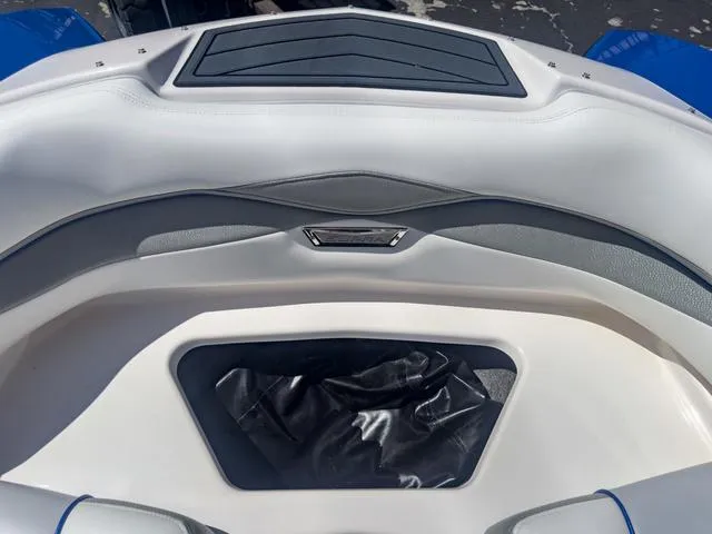 Slide: The Image of 2013 Supra SA 350 boat interior, white and gray seating with storage compartment. - 47