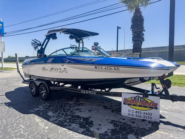 Slide: The Image of 2013 Supra SA 350 boat on trailer at South Austin Marine dealership. - 49