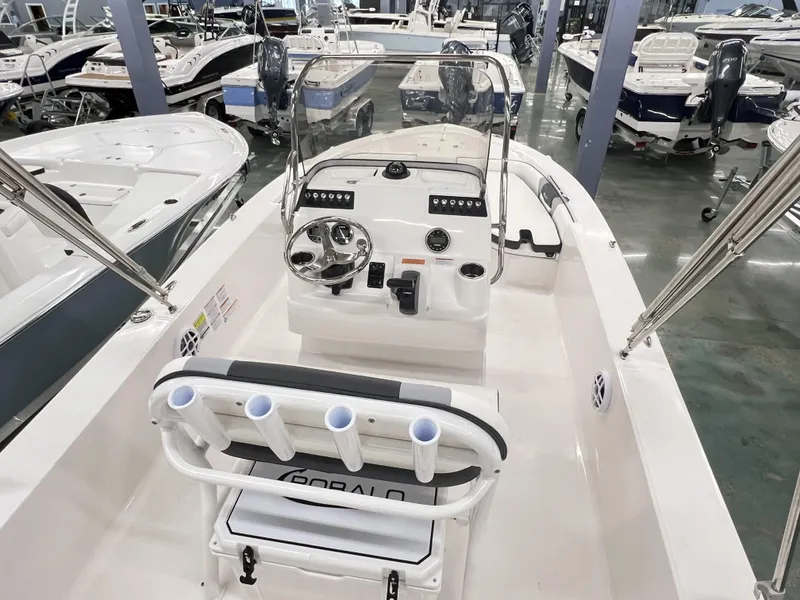 Slide: The Image of 2024 Robalo ROBALO 206 boat interior with console and seating in showroom. - 3