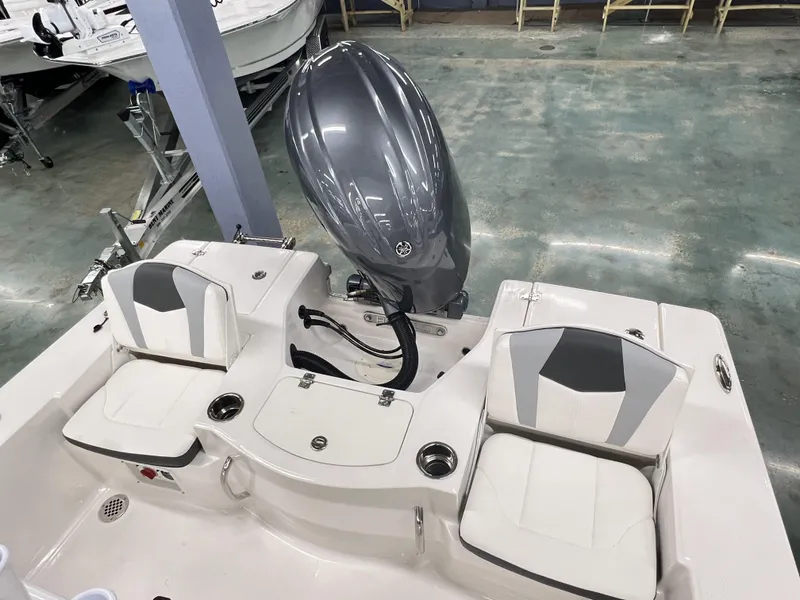 Slide: The Image of 2024 Robalo ROBALO 206 boat interior with dual seats and outboard motor. - 5