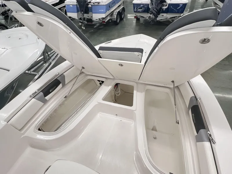 Slide: The Image of 2024 Robalo ROBALO 206 boat interior with open storage compartments. - 7
