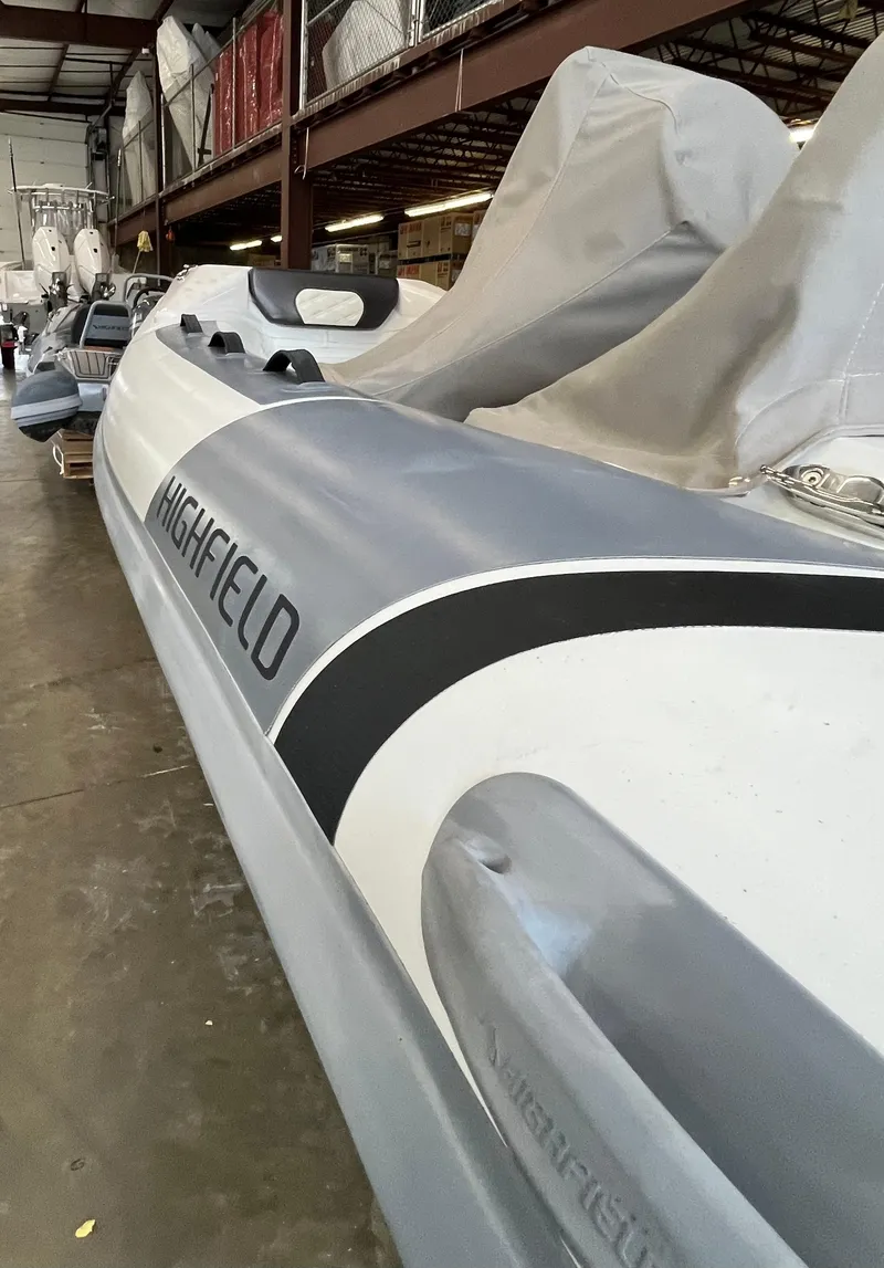 Slide: The Image of 2022 Highfield SP300 inflatable boat in storage facility. - 2