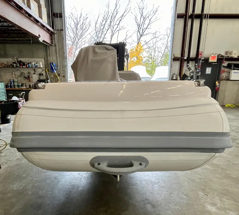 Slide: The Image of 2022 Highfield SP300 boat in a garage, rear view. - 3
