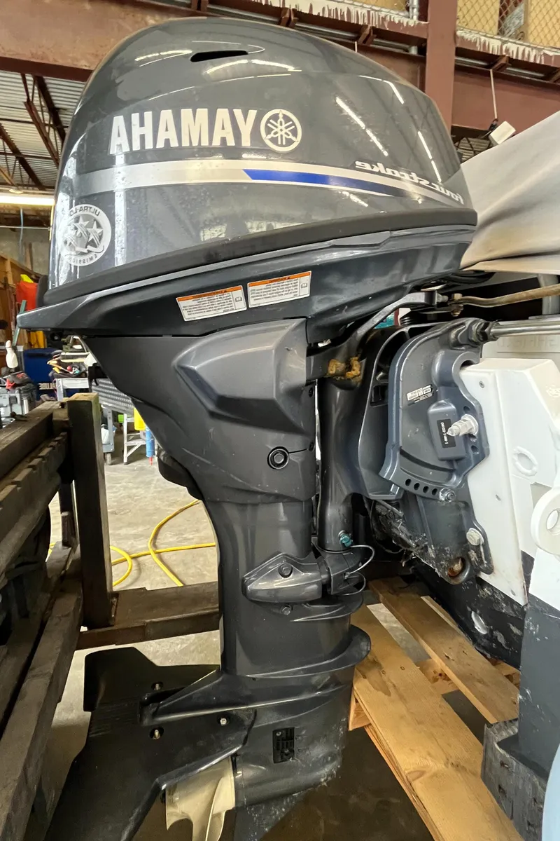 Slide: The Image of 2022 Highfield SP300 outboard motor in a workshop setting. - 4