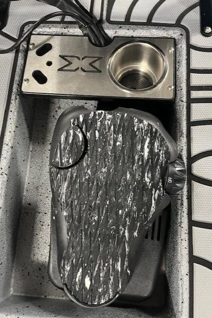Slide: The Image of Foot pedal and cup holder in a 2022 Express XPRESS X19PRO boat. - 10