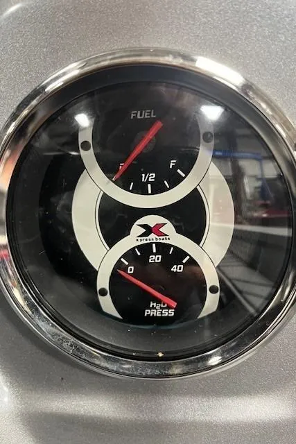 Slide: The Image of 2022 Express XPRESS X19PRO fuel and oil pressure gauge. - 13