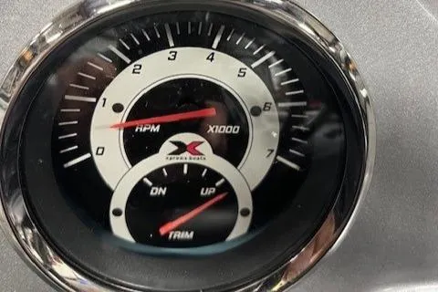 Slide: The Image of Close-up of 2022 Express XPRESS X19PRO boat tachometer and trim gauge. - 15