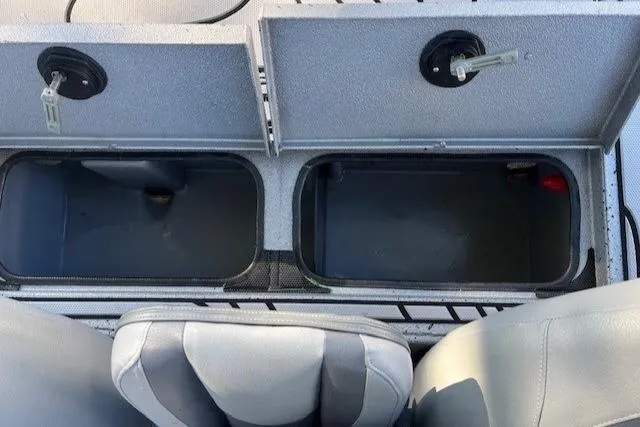 Slide: The Image of 2022 Express XPRESS X19PRO boat storage compartments and seating. - 19