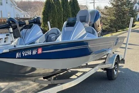 Slide: The Image of 2022 Express XPRESS X19PRO fishing boat on trailer, blue and gray, side view. - 3