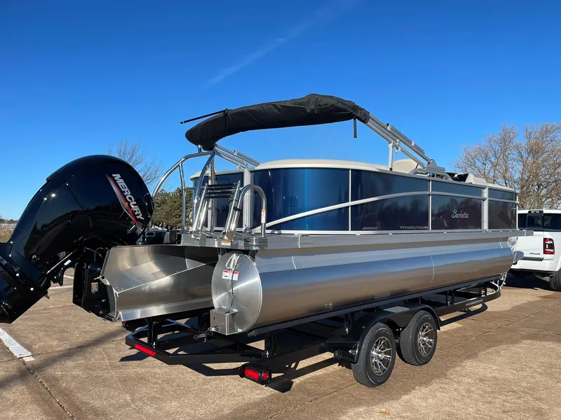 Slide: The Image of 2024 Barletta ARIA 22QC pontoon boat on a trailer with a Mercury outboard motor. - 13