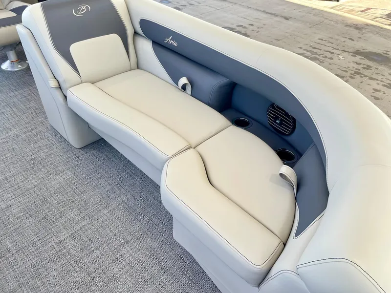 Slide: The Image of 2024 Barletta ARIA 22QC boat interior with luxurious seating and cup holders. - 26