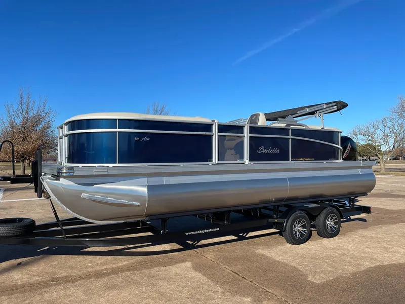 Slide: The Image of 2024 Barletta ARIA 22QC pontoon boat on a trailer, side view. - 3