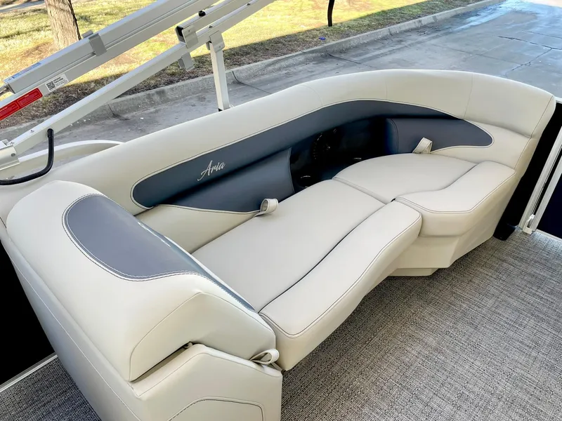 Slide: The Image of 2024 Barletta ARIA 22QC boat interior seating with beige and gray upholstery. - 32