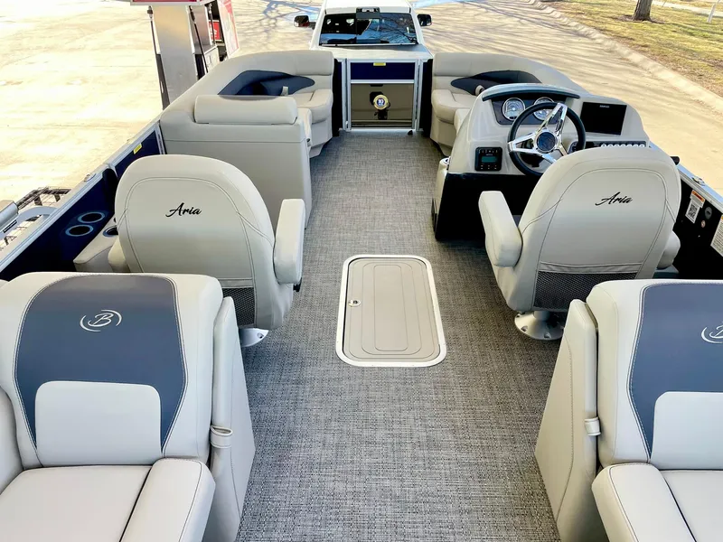 Slide: The Image of 2024 Barletta ARIA 22QC pontoon boat interior with plush seating and modern dashboard. - 33