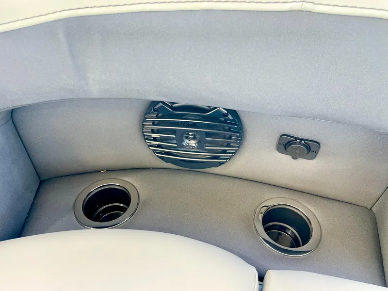 Slide: The Image of 2024 Barletta ARIA 22QC boat interior with cup holders and speaker. - 39