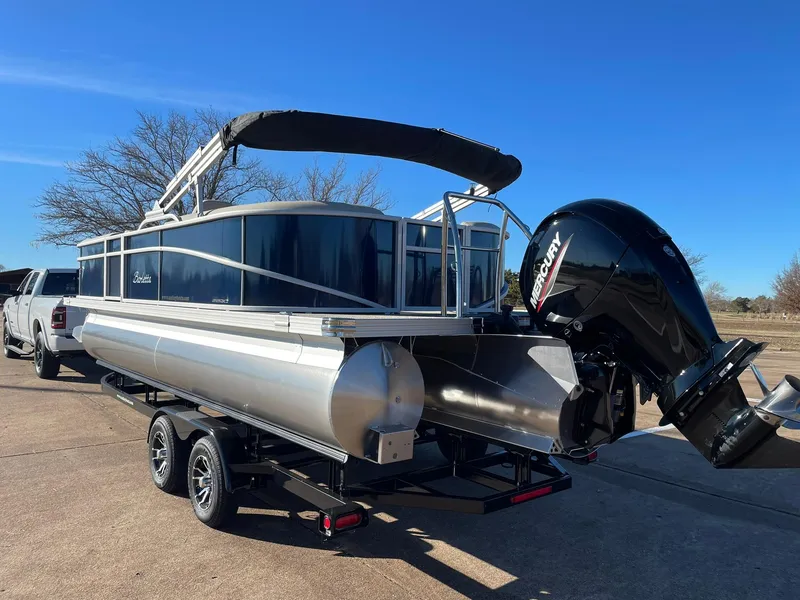 Slide: The Image of 2024 Barletta ARIA 22QC pontoon boat on trailer with Mercury outboard motor. - 9