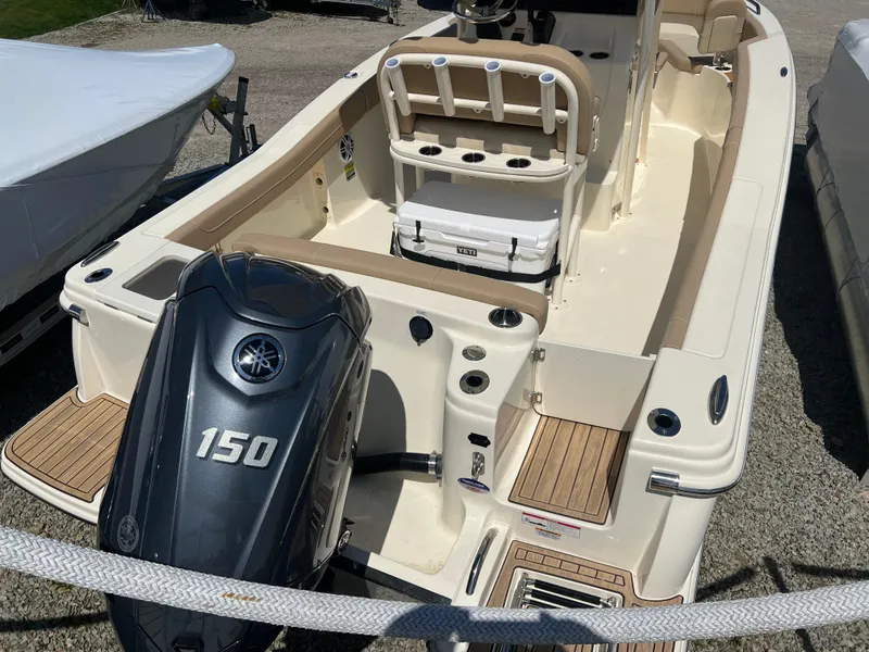 Slide: The Image of 2024 Scout 215 XSF boat with Yamaha 150 outboard motor. - 3